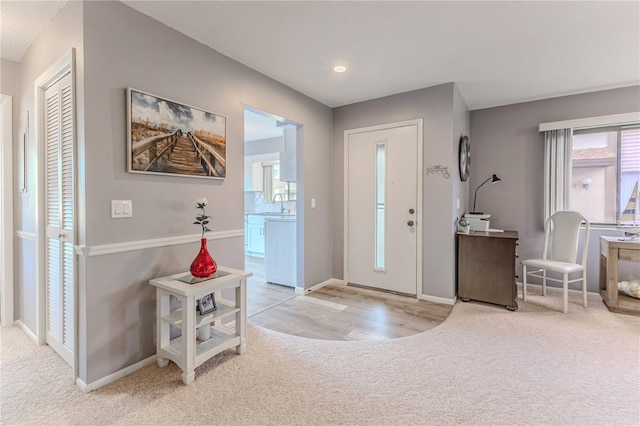 entrance foyer featuring light hardwood / wood-style floors and sink