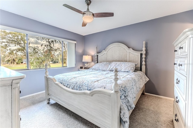 12814 Wedgewood Way Unit C, Hudson, FL 34667 - bedroom with light colored carpet and a ceiling fan