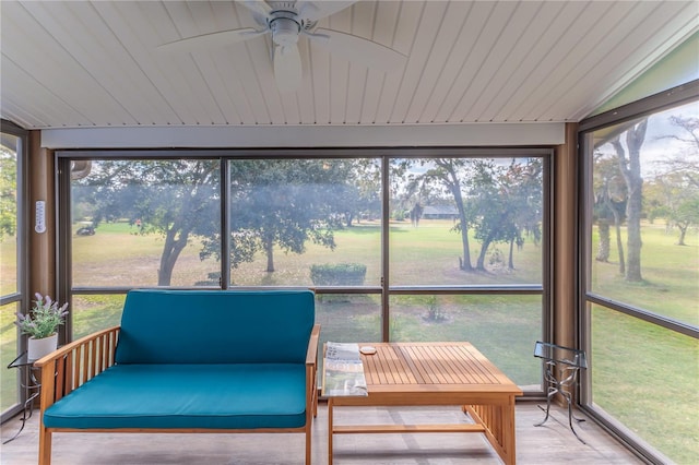 sunroom featuring ceiling fan, wooden ceiling, and vaulted ceiling