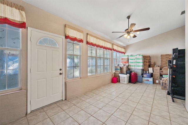 interior space with ceiling fan