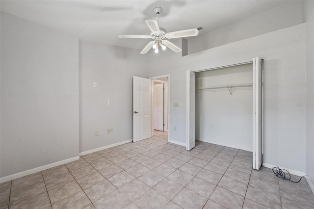 unfurnished bedroom with ceiling fan, a closet, and light tile patterned floors