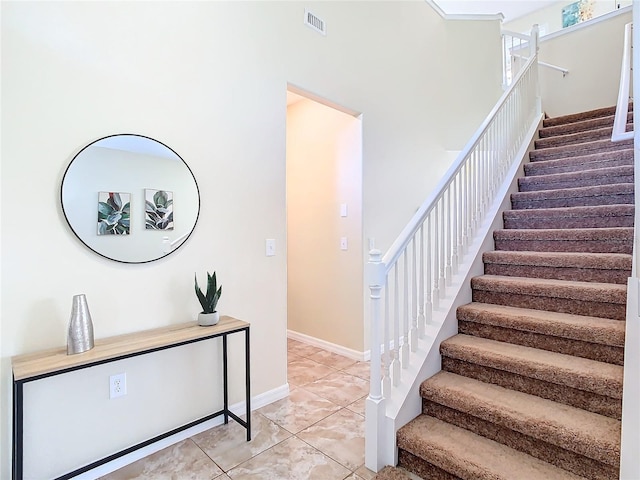 stairs featuring tile patterned floors