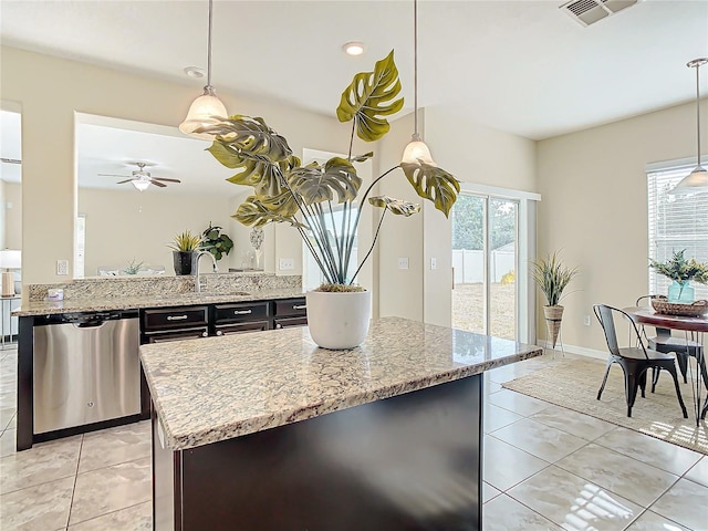 kitchen with ceiling fan, dishwasher, sink, decorative light fixtures, and light tile patterned floors