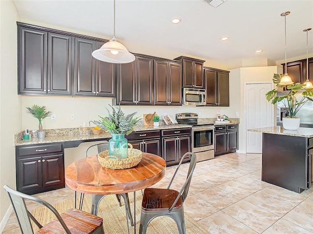 kitchen featuring dark brown cabinetry, light stone countertops, hanging light fixtures, stainless steel appliances, and light tile patterned flooring