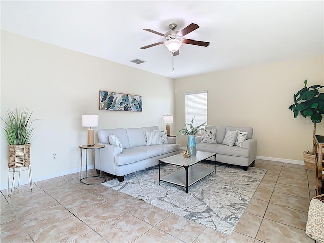 tiled living room with ceiling fan