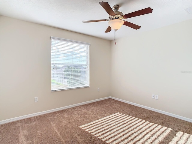 empty room with carpet floors and ceiling fan