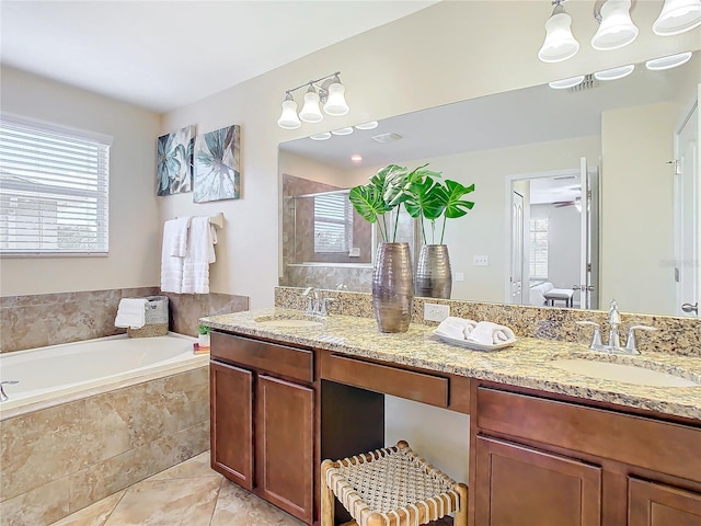 bathroom featuring tile patterned flooring, vanity, ceiling fan, and independent shower and bath