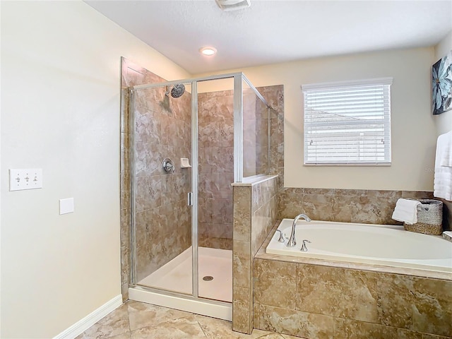 bathroom with separate shower and tub