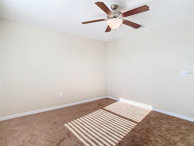 unfurnished room with ceiling fan and carpet floors