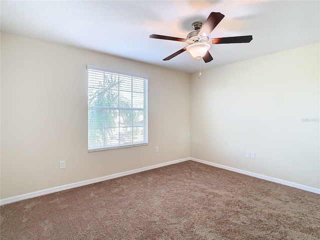 carpeted empty room with ceiling fan