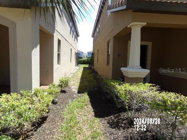 5537 Misty Oak Cir, Davenport, FL 33837 - view of property exterior with stucco siding