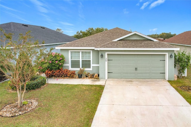 ranch-style house featuring a garage and a front lawn