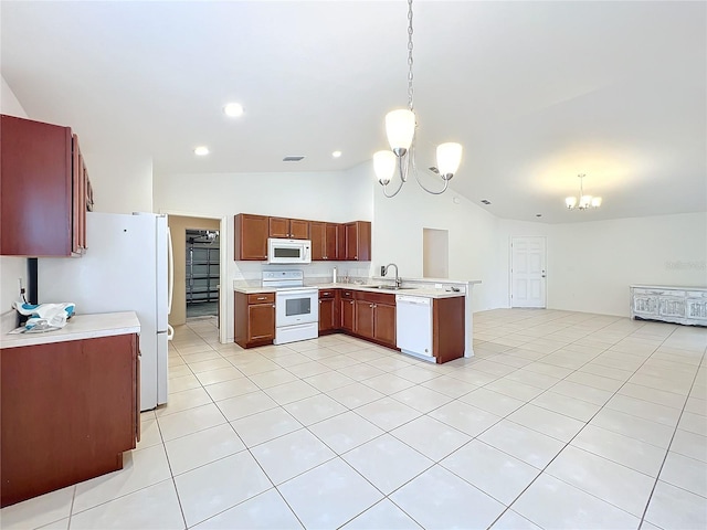 kitchen with white appliances, vaulted ceiling, hanging light fixtures, and a notable chandelier