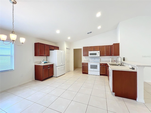 kitchen featuring sink, hanging light fixtures, kitchen peninsula, vaulted ceiling, and white appliances