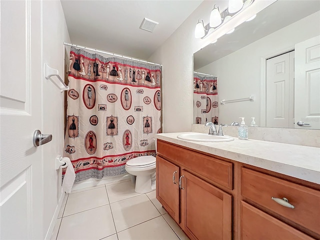 bathroom featuring tile patterned floors, vanity, a shower with shower curtain, and toilet