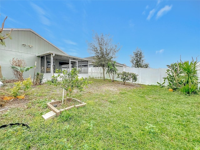 view of yard with a sunroom