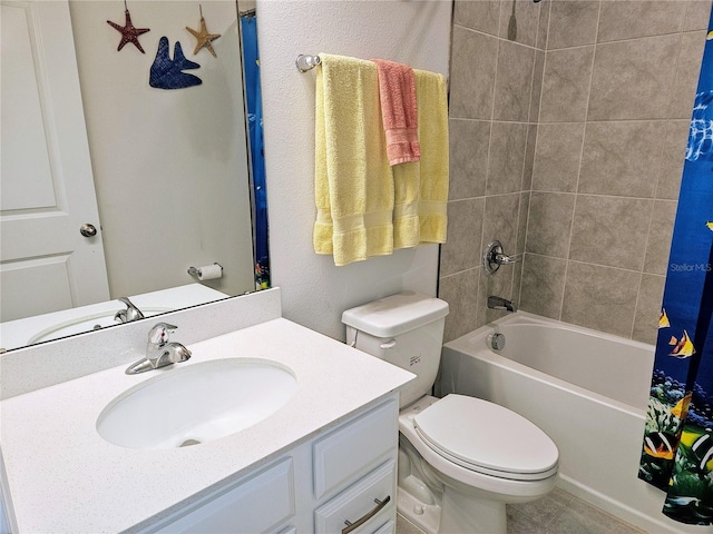 full bathroom with vanity, shower / tub combo, and toilet