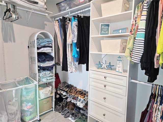 spacious closet featuring tile patterned flooring