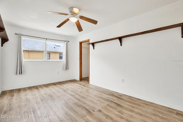 spare room with ceiling fan and light hardwood / wood-style floors