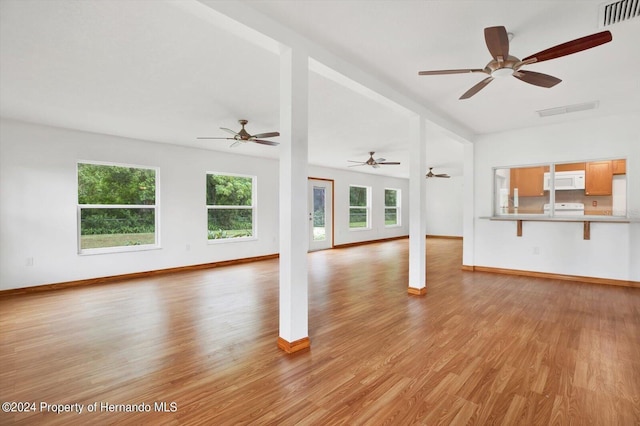 unfurnished living room featuring light hardwood / wood-style flooring