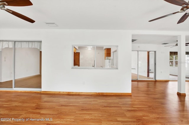 spare room with wood-type flooring