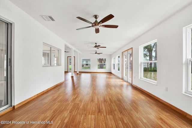 interior space with ceiling fan and light wood-type flooring