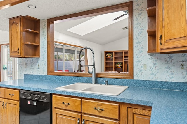 kitchen with lofted ceiling with skylight, dishwasher, ceiling fan, and sink