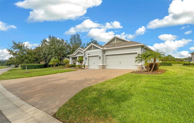 view of front of home with a garage and a front lawn