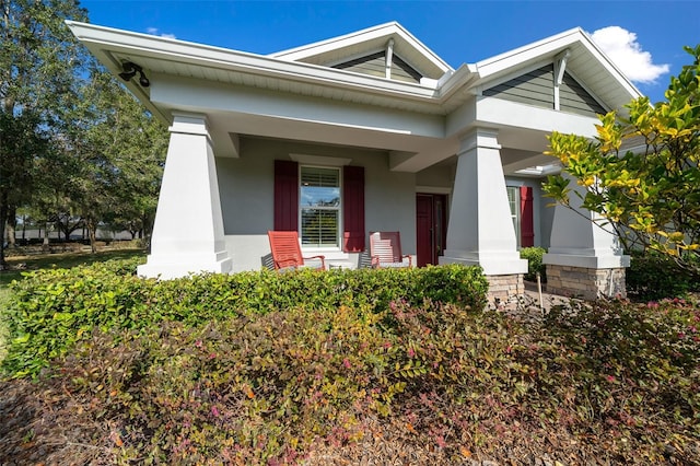 property entrance with covered porch