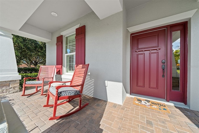 doorway to property featuring covered porch