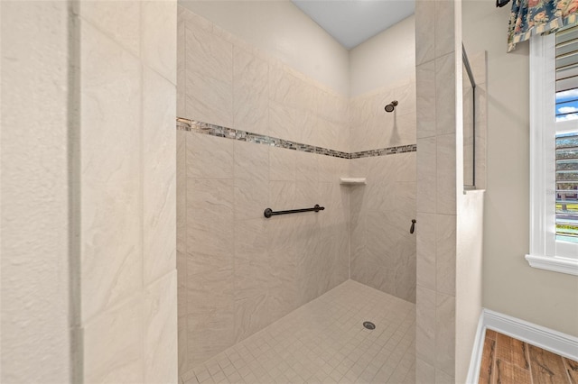 bathroom with tiled shower