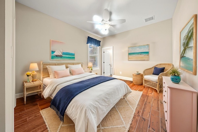 bedroom with ceiling fan and hardwood / wood-style floors