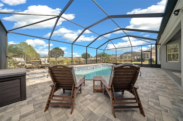 view of patio / terrace with glass enclosure