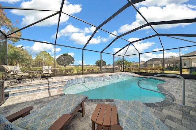 view of pool with a lanai and a patio area