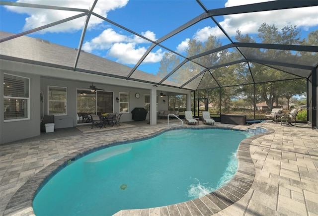 view of swimming pool with a jacuzzi, a patio, ceiling fan, and a lanai