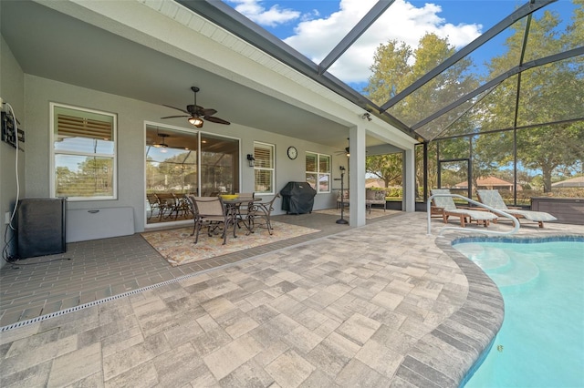 unfurnished sunroom featuring ceiling fan