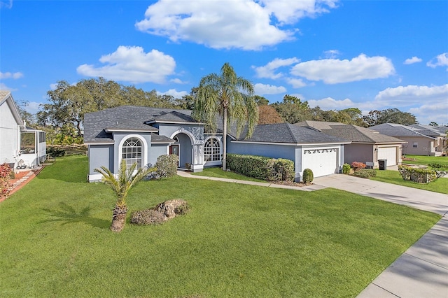 ranch-style house with a front lawn and a garage