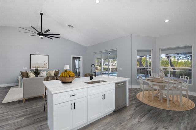 kitchen with a kitchen island with sink, dark wood-type flooring, stainless steel dishwasher, white cabinets, and sink