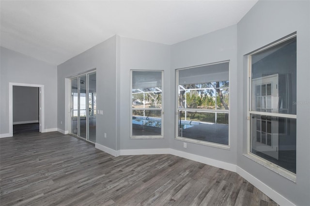 empty room featuring dark hardwood / wood-style flooring