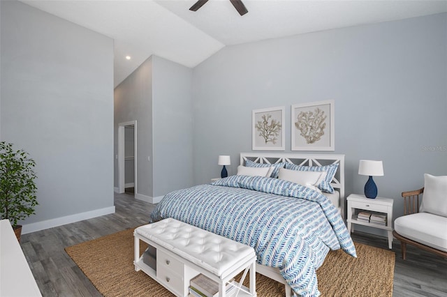 bedroom featuring ceiling fan, dark wood-type flooring, and lofted ceiling