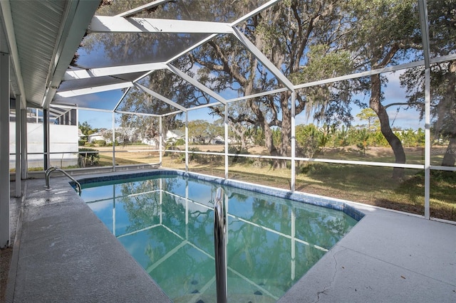 view of pool featuring glass enclosure