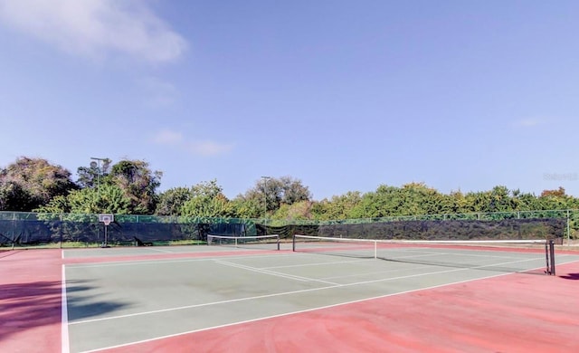 view of sport court featuring basketball hoop