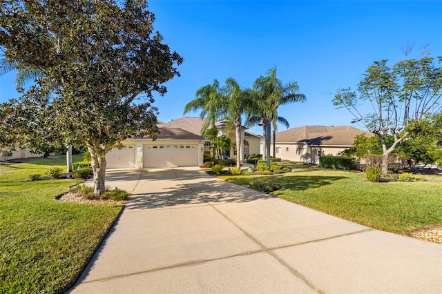 view of front of property with a garage and a front yard