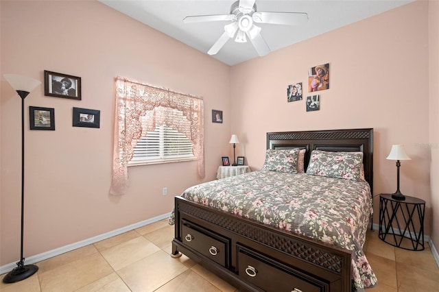 bedroom with ceiling fan and light tile patterned floors