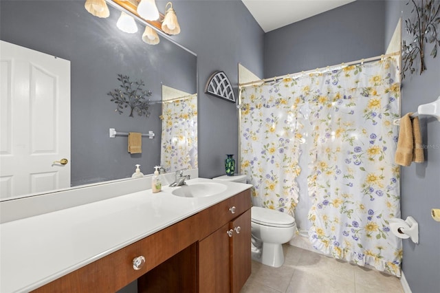 bathroom with tile patterned floors, vanity, and toilet