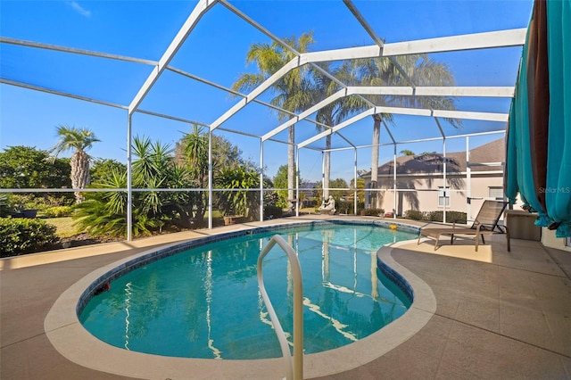 view of pool featuring a lanai and a patio area