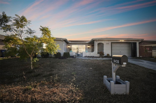 ranch-style home with a garage