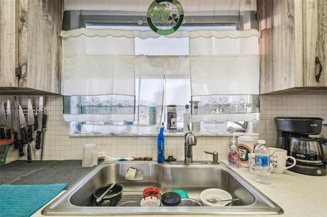 kitchen with decorative backsplash and sink