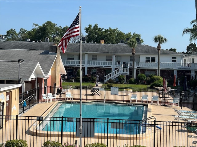 view of swimming pool with a patio