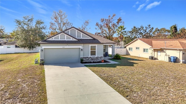 view of front of home with a garage and a front lawn